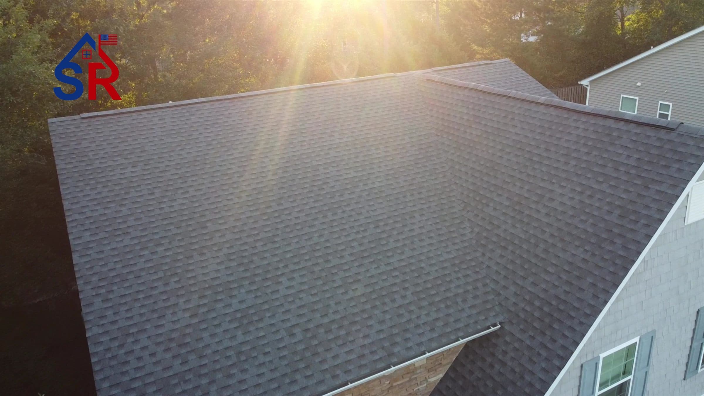Completed architectural shingle roof replacement, drone view